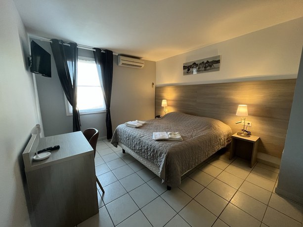 Imagen de la habitación del Hotel H&ocirc;tel les Arcades, Saintes Maries de la Mer. Foto 11