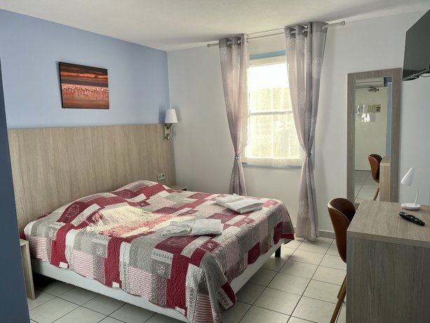 Imagen de la habitación del Hotel H&ocirc;tel les Arcades, Saintes Maries de la Mer. Foto 14
