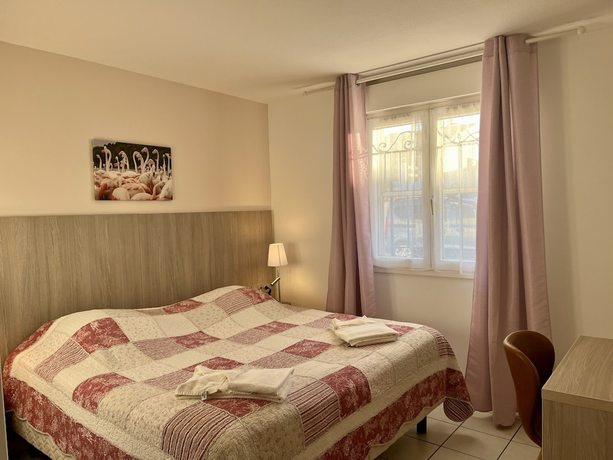 Imagen de la habitación del Hotel H&ocirc;tel les Arcades, Saintes Maries de la Mer. Foto 16