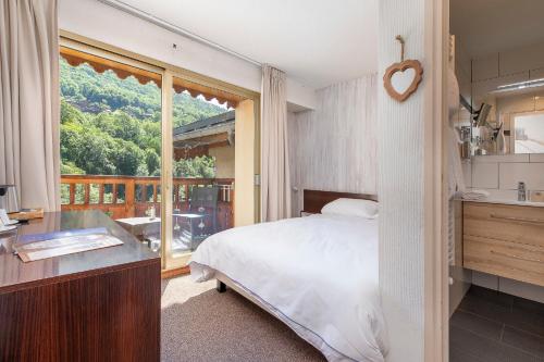 Imagen de la habitación del Hotel H&ocirc;tel les Bains. Foto 16