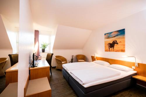 Imagen de la habitación del Hotel Hogh Heilbronn. Foto 16