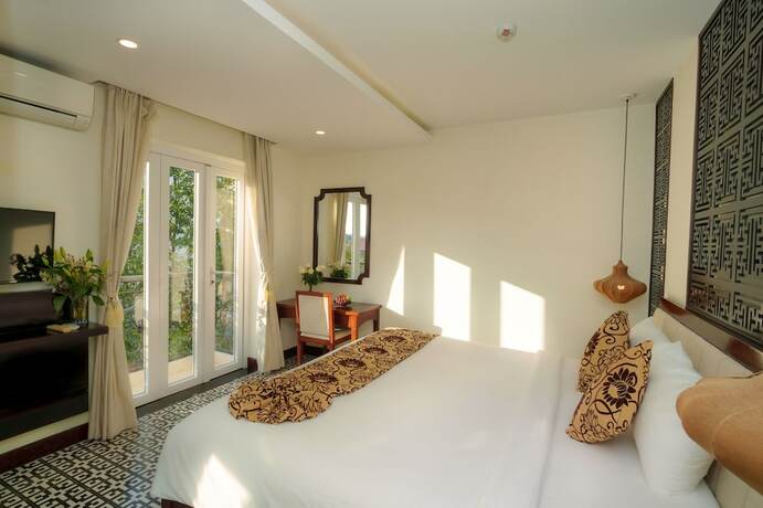 Imagen de la habitación del Hotel Hoi An Canal House. Foto 26