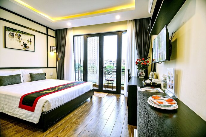 Imagen de la habitación del Hotel Hoi An Riverland Villa. Foto 22