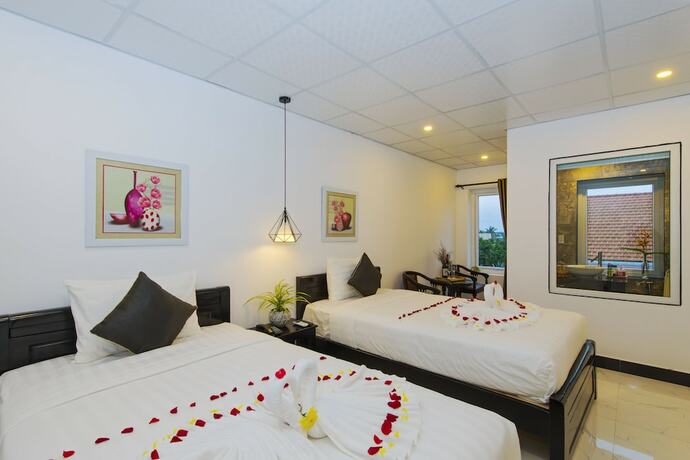 Imagen de la habitación del Hotel Hoi An Sunny Pool Villa. Foto 18