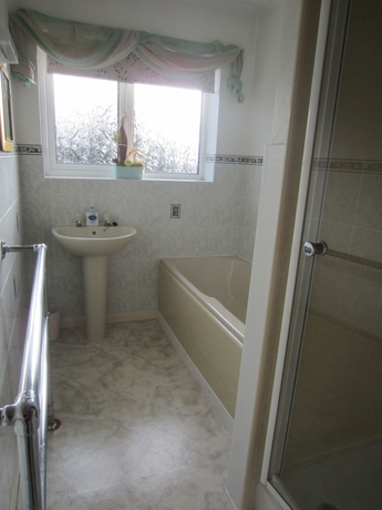 Imagen de la habitación del Hotel Holcombe Guest House. Foto 11