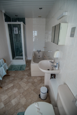 Imagen de la habitación del Hotel Holcombe Guest House. Foto 12