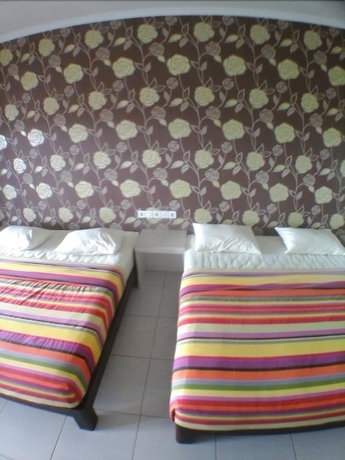 Imagen de la habitación del Hotel Holiday Beach Inn. Foto 4