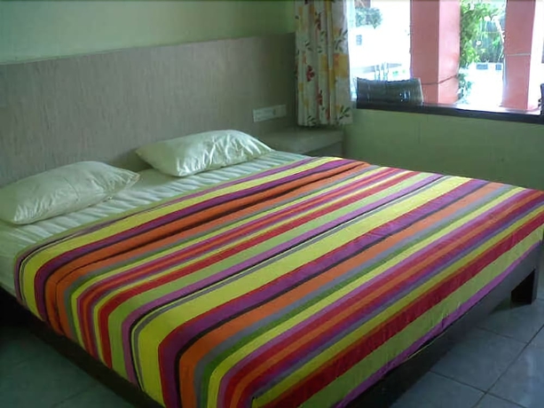 Imagen de la habitación del Hotel Holiday Beach Inn. Foto 11