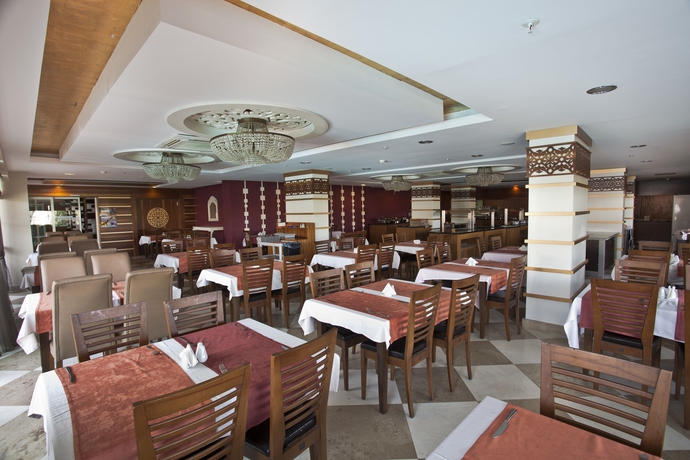 Imagen del bar/restaurante del Hotel Holiday City. Foto 3