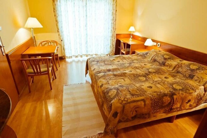 Imagen de la habitación del Hotel Holiday Club Apartman. Foto 6