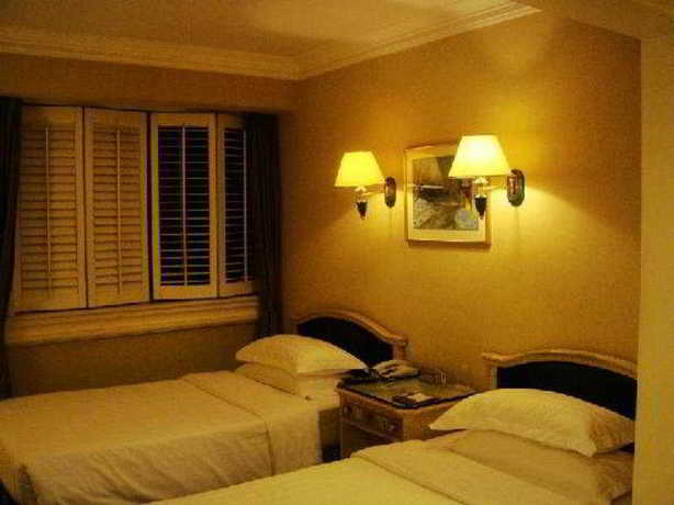 Imagen de la habitación del Hotel Holiday Garden. Foto 6