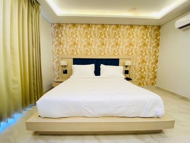 Imagen de la habitación del Hotel Holiday Grand Near Expo Mart. Foto 6