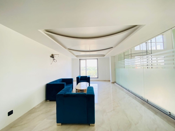 Imagen de la habitación del Hotel Holiday Grand Near Expo Mart. Foto 14