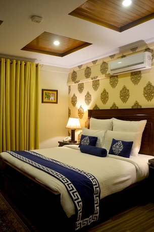 Imagen de la habitación del Hotel Holiday Grand Resort Bhurban. Foto 3