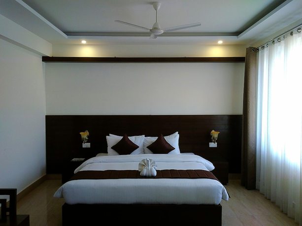 Imagen de la habitación del Hotel Holiday Hill, Rishikesh. Foto 2