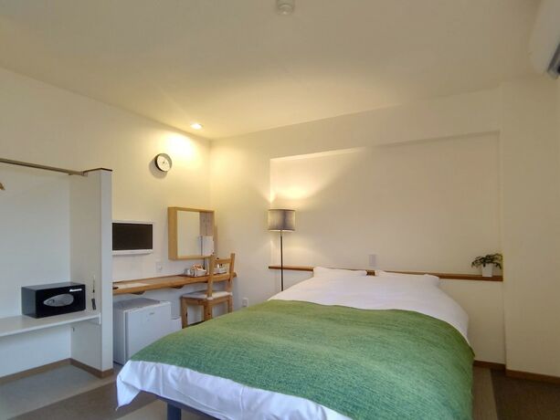 Imagen de la habitación del Hotel Holiday House Green Garden. Foto 16