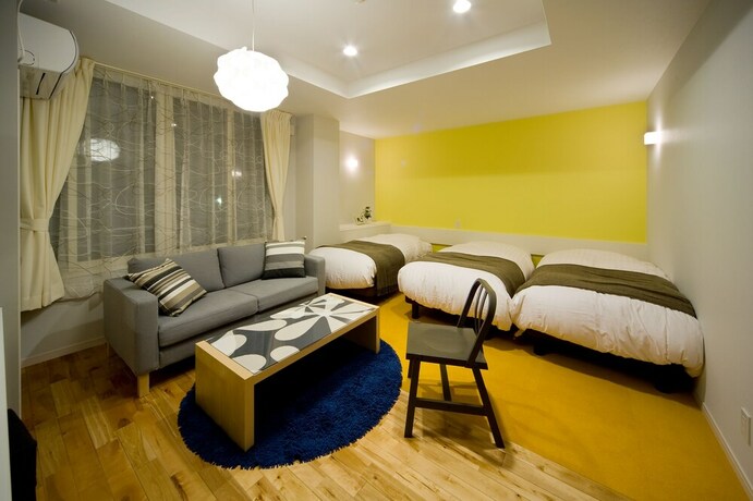 Imagen de la habitación del Hotel Holiday House Green Garden. Foto 18