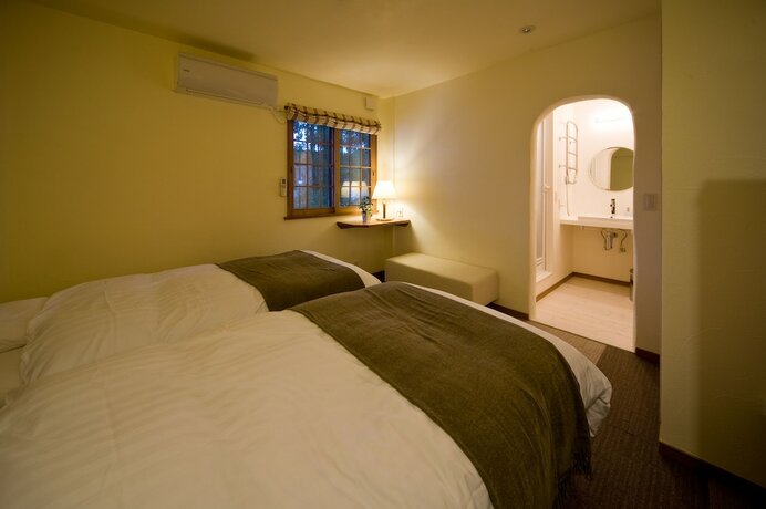 Imagen de la habitación del Hotel Holiday House Green Garden. Foto 21