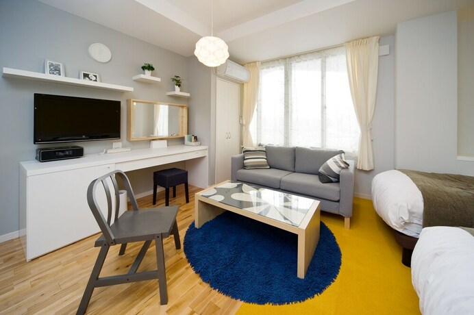 Imagen de la habitación del Hotel Holiday House Green Garden. Foto 24