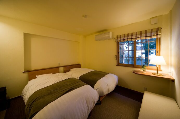 Imagen de la habitación del Hotel Holiday House Green Garden. Foto 30