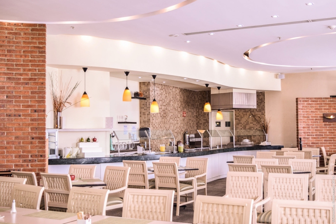 Imagen del bar/restaurante del Hotel Holiday Inn Convention Center, An Ihg. Foto 2