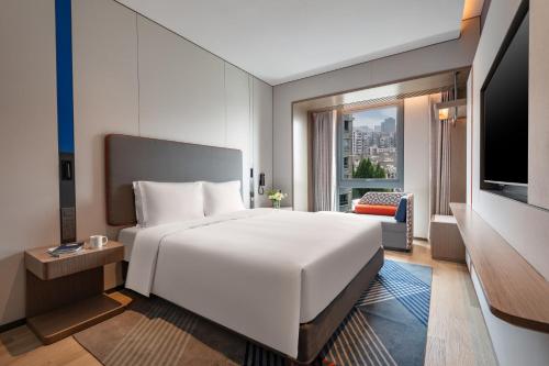Imagen de la habitación del Hotel Holiday Inn Express Changfeng Park. Foto 12