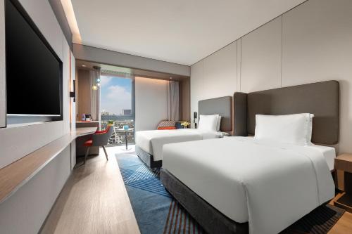 Imagen de la habitación del Hotel Holiday Inn Express Changfeng Park. Foto 14
