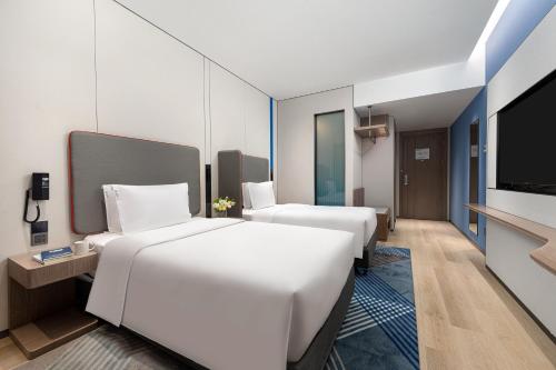Imagen de la habitación del Hotel Holiday Inn Express Changfeng Park. Foto 17