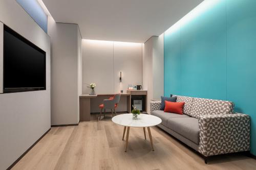 Imagen de la habitación del Hotel Holiday Inn Express Changfeng Park. Foto 19