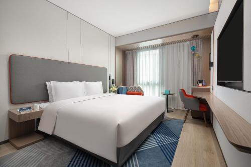 Imagen de la habitación del Hotel Holiday Inn Express Changfeng Park. Foto 20