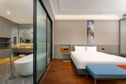 Imagen de la habitación del Hotel Holiday Inn Express Qidong Economic Zone, an IHG. Foto 15