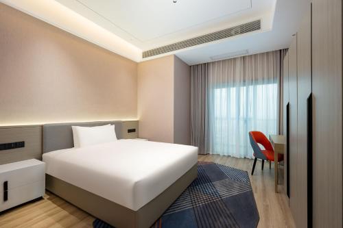 Imagen de la habitación del Hotel Holiday Inn Express Qidong Economic Zone, an IHG. Foto 16