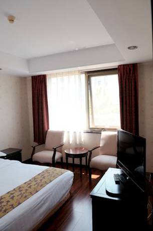 Imagen de la habitación del Hotel Holiday Inn Express Qingdao Shibei by IHG. Foto 3