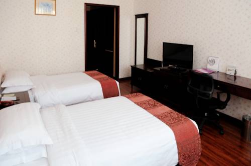 Imagen de la habitación del Hotel Holiday Inn Express Qingdao Shibei by IHG. Foto 4