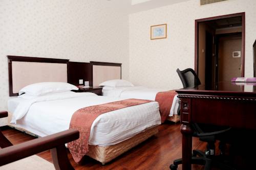 Imagen de la habitación del Hotel Holiday Inn Express Qingdao Shibei by IHG. Foto 6