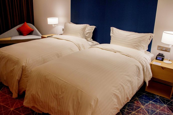 Imagen de la habitación del Hotel Holiday Inn Express Shanghai Songjiang Fangta. Foto 13