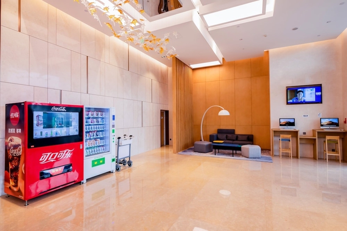 Imagen de los interiores del Hotel Holiday Inn Express Yantai Fulai. Foto 18