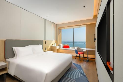 Imagen de la habitación del Hotel Holiday Inn Express Zhanjiang Coast, an IHG. Foto 17