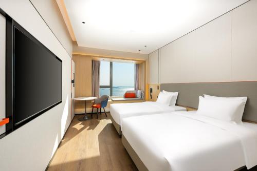 Imagen de la habitación del Hotel Holiday Inn Express Zhanjiang Coast, an IHG. Foto 18