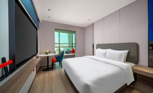 Imagen de la habitación del Hotel Holiday Inn Express Zhengzhou Garden Road. Foto 11