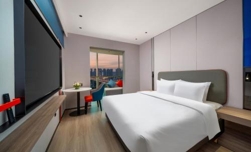 Imagen de la habitación del Hotel Holiday Inn Express Zhengzhou Garden Road. Foto 12
