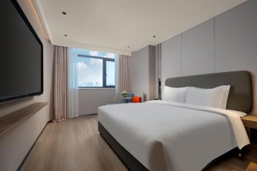 Imagen de la habitación del Hotel Holiday Inn Express Zhengzhou Garden Road. Foto 20