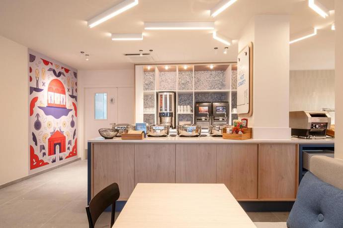 Imagen del bar/restaurante del Hotel Holiday Inn Express and Suites Ghent by IHG. Foto 2