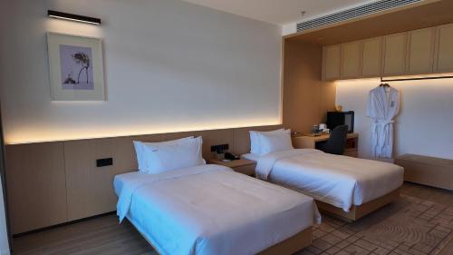 Imagen de la habitación del Hotel Holiday Inn Ganzhou Orchid Town, an IHG. Foto 17