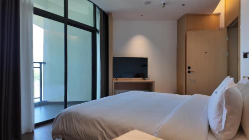 Imagen de la habitación del Hotel Holiday Inn Ganzhou Orchid Town, an IHG. Foto 18