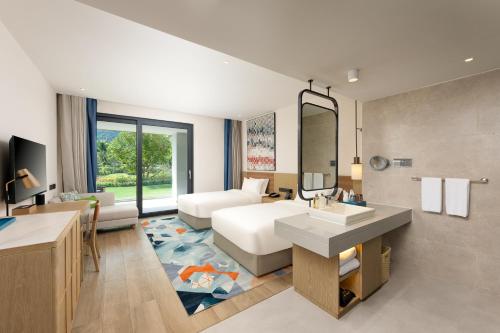 Imagen de la habitación del Hotel Holiday Inn Hainan Xiangshui Bay, an IHG. Foto 13