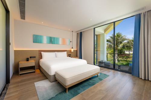 Imagen de la habitación del Hotel Holiday Inn Hainan Xiangshui Bay, an IHG. Foto 14