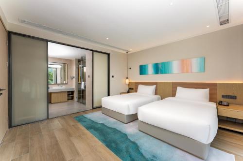 Imagen de la habitación del Hotel Holiday Inn Hainan Xiangshui Bay, an IHG. Foto 15