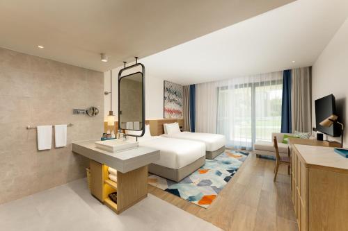 Imagen de la habitación del Hotel Holiday Inn Hainan Xiangshui Bay, an IHG. Foto 20
