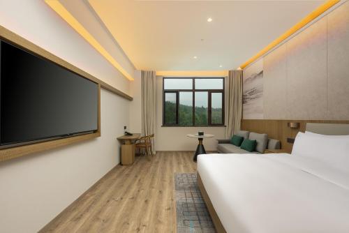 Imagen de la habitación del Hotel Holiday Inn Jiuhua Mountain Hot Spring, an IHG. Foto 12